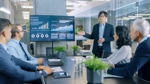 Businessman giving presentation with analytics